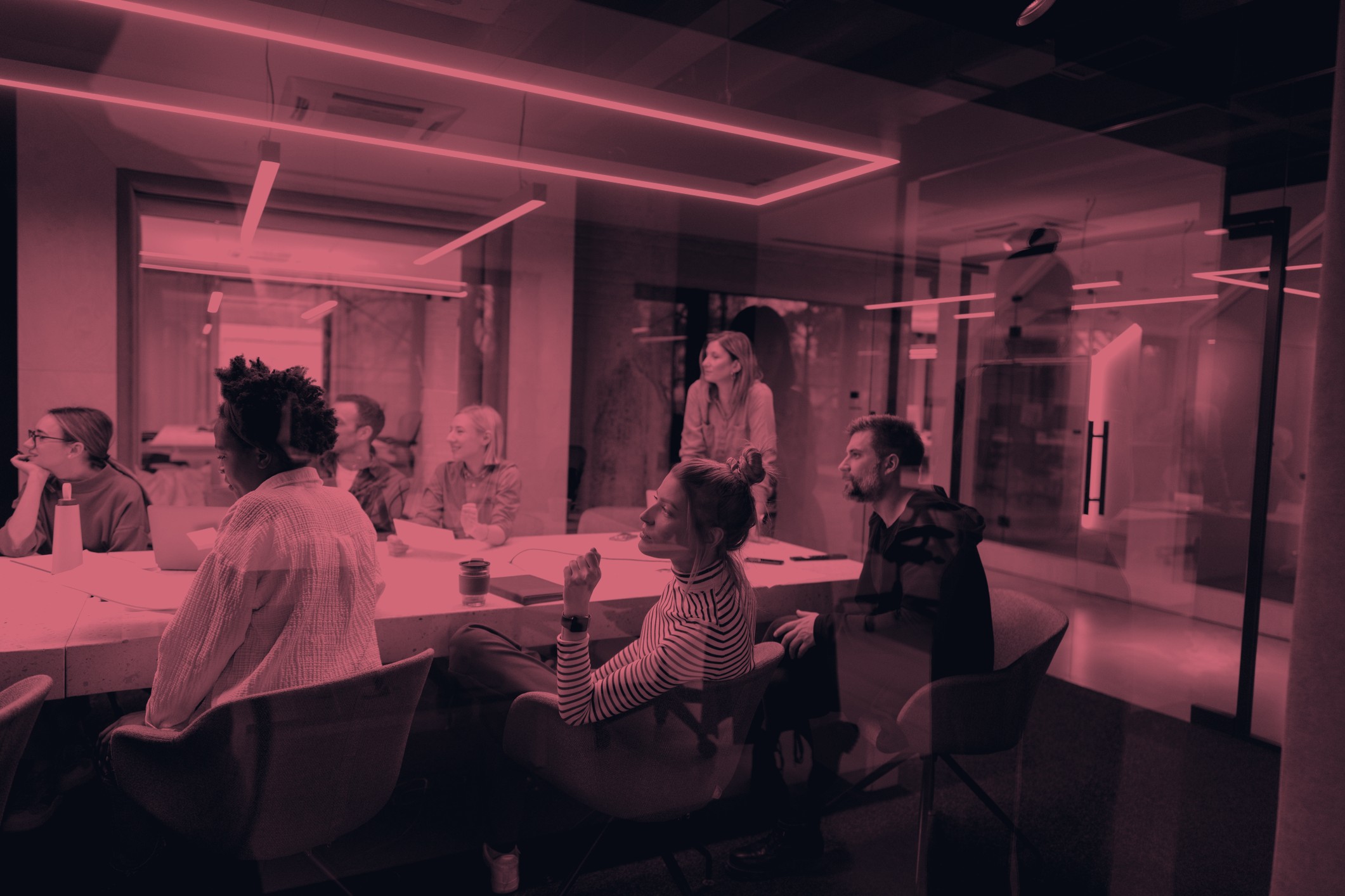 A marketing team meeting around a boardroom table